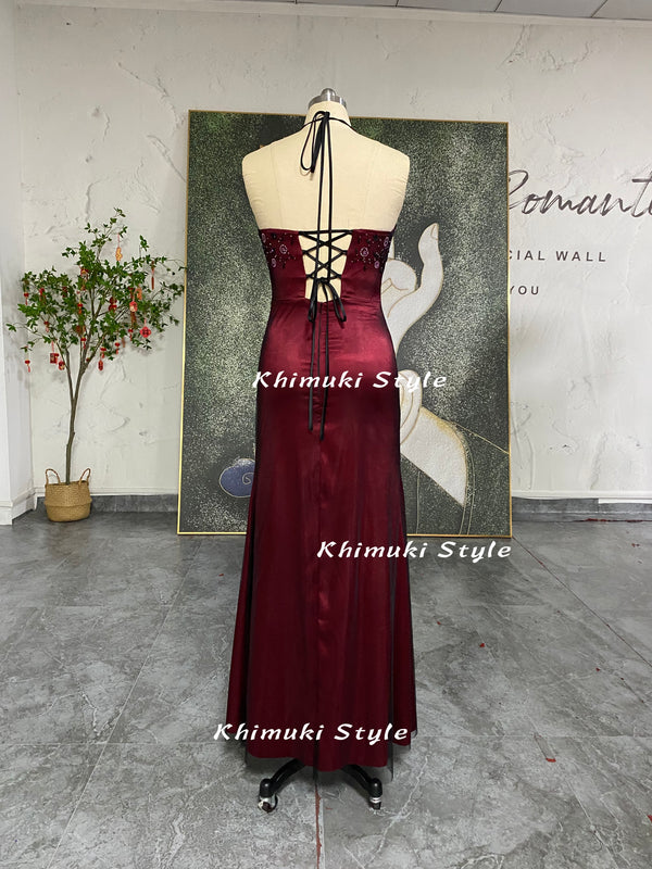halter neckline beaded black and red prom gown