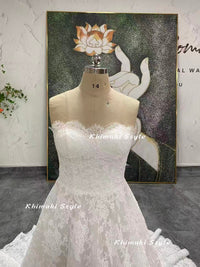 ivory lace strapless wedding gown